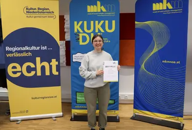 Teilnehmende Person mit Zertifikat.