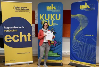 Teilnehmende Person mit Zertifikat.