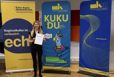 Teilnehmende Person mit Zertifikat.