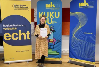 Teilnehmende Person mit Zertifikat.