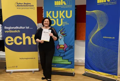 Teilnehmende Person mit Zertifikat.