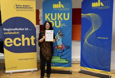 Teilnehmende Person mit Zertifikat.